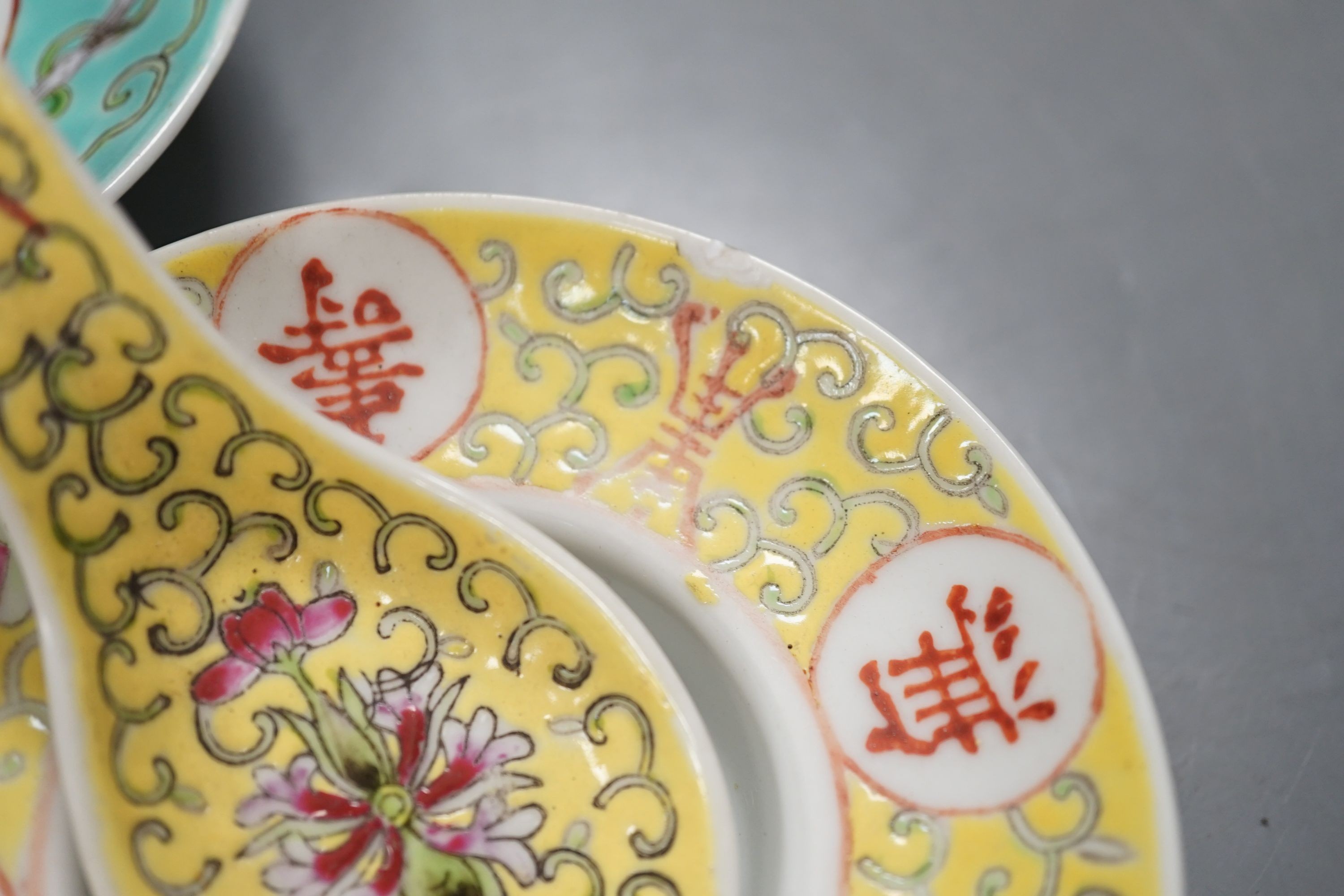 Five Chinese ceramic figures, saucers, etc., tallest 15cm. (18)